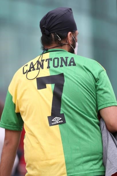 Manchester United fan is seen wearing an Eric Cantona shirt prior to the Premier League match between Manchester United and Leeds United at Old...