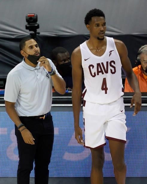 Head coach J.J. Outlaw of the Cleveland Cavaliers looks on as Evan Mobley checks in to a game against the New Orleans Pelicans during the 2021 NBA...