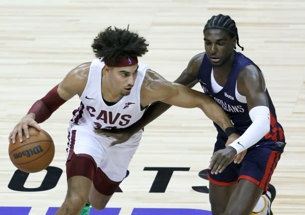 Brodric Thomas of the Cleveland Cavaliers drives against Kira Lewis Jr. #13 of the New Orleans Pelicans during the 2021 NBA Summer League at the...