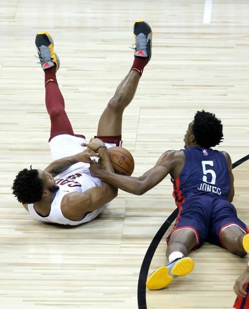 Lamar Stevens of the Cleveland Cavaliers and Herbert Jones of the New Orleans Pelicans vie for a loose ball during the 2021 NBA Summer League at the...