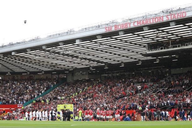 The teams line up prior to the Premier League match between Manchester United and Leeds United at Old Trafford on August 14, 2021 in Manchester,...