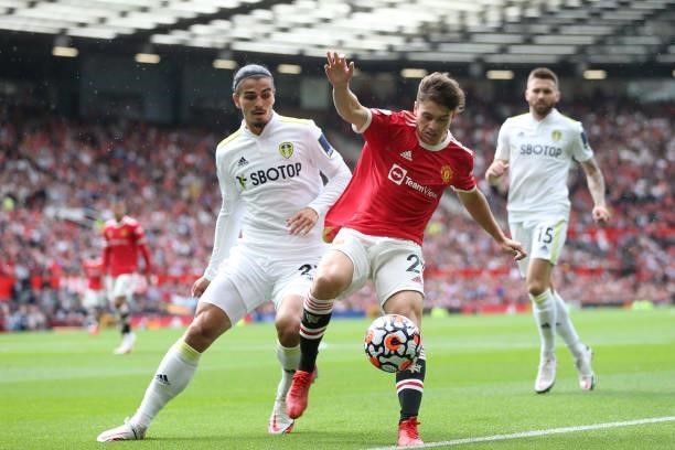 Daniel James of Manchester United is challenged by Pascal Struijk of Leeds United during the Premier League match between Manchester United and Leeds...