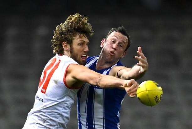 Tom Hickey of the Swans and Todd Goldstein of the Kangaroos compete in the ruck during the round 22 AFL match between North Melbourne Kangaroos and...
