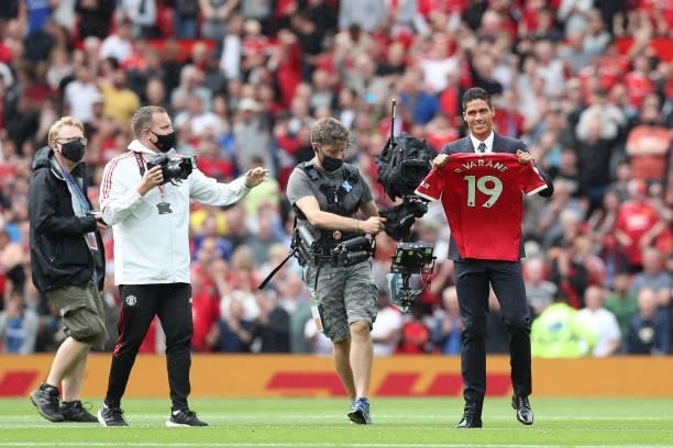 New signing, Raphael Varane of Manchester United is introduced to fans on the pitch prior to the Premier League match between Manchester United and...