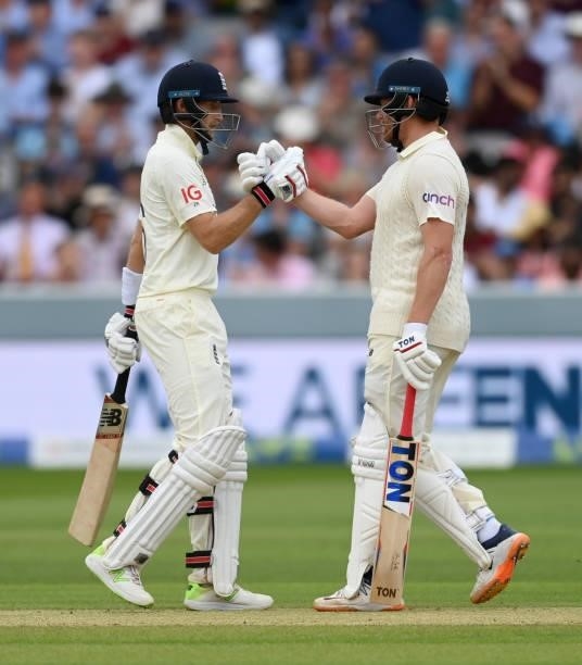 Joe Root and Jonathan Bairstow of England shake hands after reaching their 100 partnership during day three of the Second LV= Insurance Test Match...