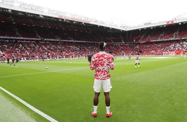 Paul Pogba of Manchester United warms up ahead of the Premier League match between Manchester United and Leeds United at Old Trafford on August 14,...