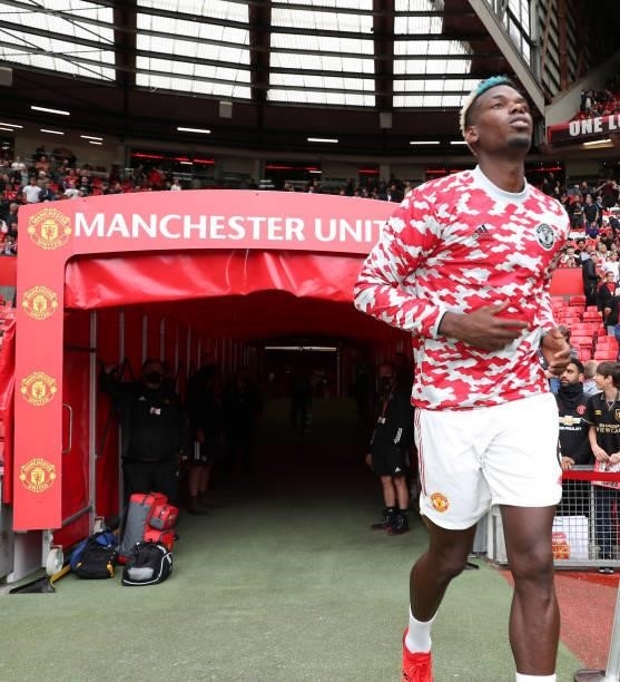 Paul Pogba of Manchester United warms up ahead of the Premier League match between Manchester United and Leeds United at Old Trafford on August 14,...