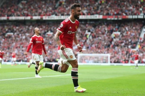 Bruno Fernandes of Manchester United celebrates after scoring their side's first goal during the Premier League match between Manchester United and...