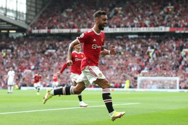 Bruno Fernandes of Manchester United celebrates after scoring their side's first goal during the Premier League match between Manchester United and...