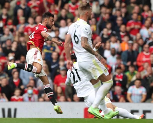Bruno Fernandes of Manchester United scores their first goal during the Premier League match between Manchester United and Leeds United at Old...