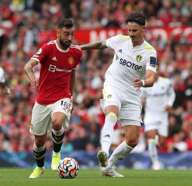Bruno Fernandes of Manchester United in action with Pascal Struijk of Leeds United during the Premier League match between Manchester United and...