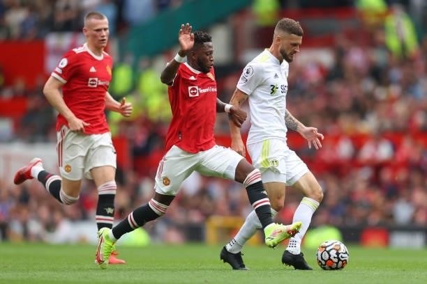 Fred of Manchester United battles for possession with Mateusz Klich of Leeds United during the Premier League match between Manchester United and...