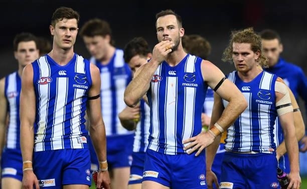The Kangaroos look dejected after losing the round 22 AFL match between North Melbourne Kangaroos and Sydney Swans at Marvel Stadium on August 14,...