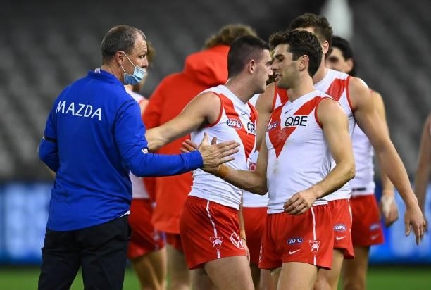 Kangaroos assistant coach John Blakey shakes hands with the Swans players during the round 22 AFL match between North Melbourne Kangaroos and Sydney...