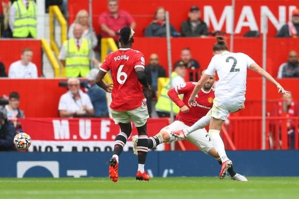 Luke Ayling of Leeds United scores their side's first goal during the Premier League match between Manchester United and Leeds United at Old Trafford...