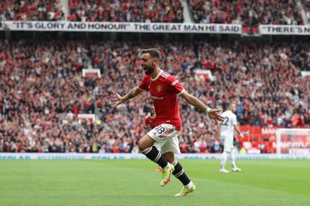Bruno Fernandes of Manchester United celebrates after scoring their side's third goal during the Premier League match between Manchester United and...