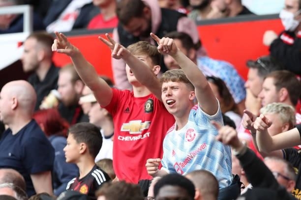 Manchester United fans show their support during the Premier League match between Manchester United and Leeds United at Old Trafford on August 14,...