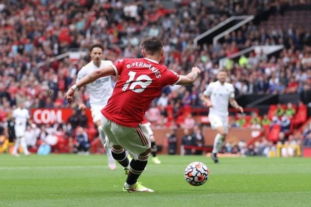 Bruno Fernandes of Manchester United scores their side's third goal during the Premier League match between Manchester United and Leeds United at Old...