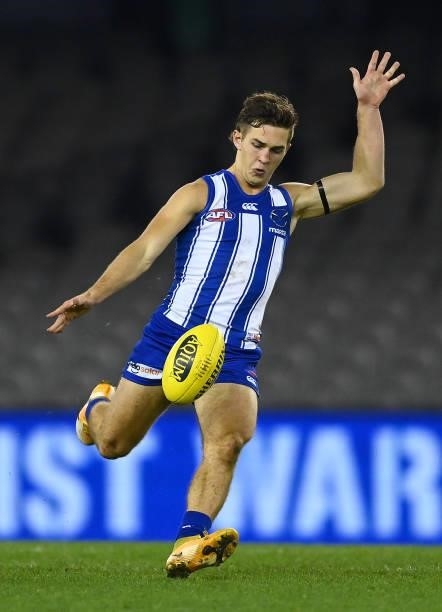 Will Phillips of the Kangaroos kicks during the round 22 AFL match between North Melbourne Kangaroos and Sydney Swans at Marvel Stadium on August 14,...