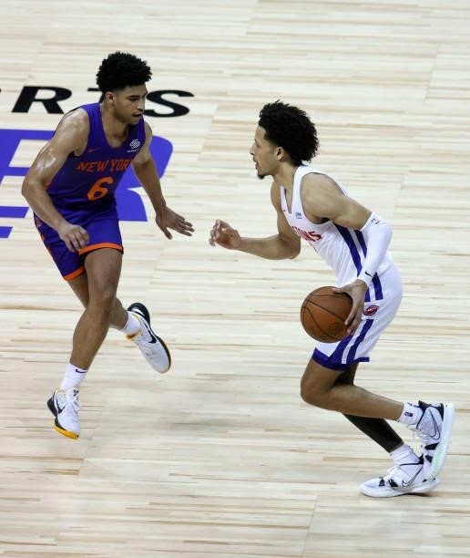 Cade Cunningham of the Detroit Pistons brings the ball up the court against Quentin Grimes of the New York Knicks during the 2021 NBA Summer League...