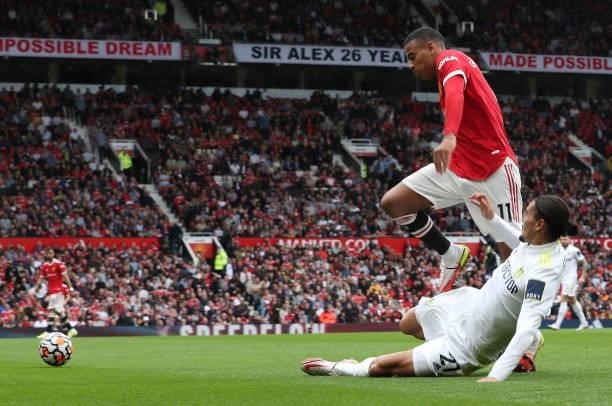 Mason Greenwood of Manchester United in action with Pascal Struijk of Leeds United during the Premier League match between Manchester United and...