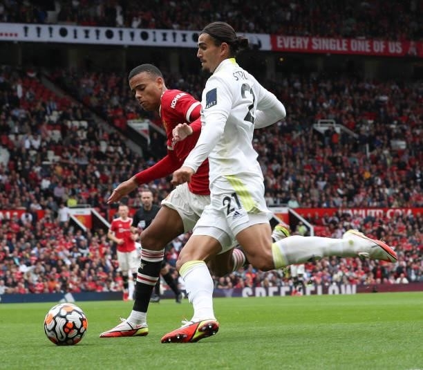 Mason Greenwood of Manchester United in action with Pascal Struijk of Leeds United during the Premier League match between Manchester United and...