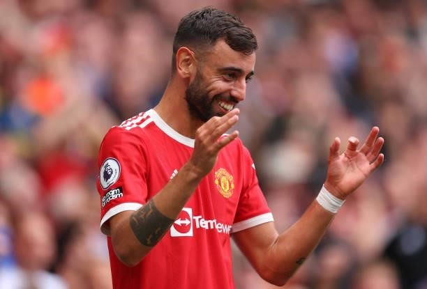 Bruno Fernandes of Manchester United celebrates after scoring their side's fourth goal and his hat-trick during the Premier League match between...