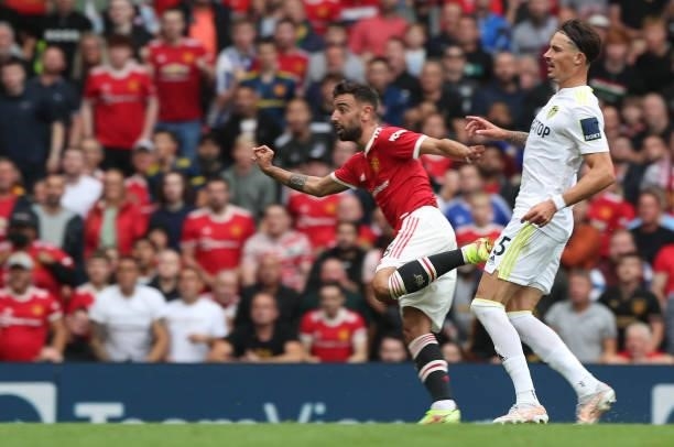 Bruno Fernandes of Manchester Unitedscores their third goal during the Premier League match between Manchester United and Leeds United at Old...