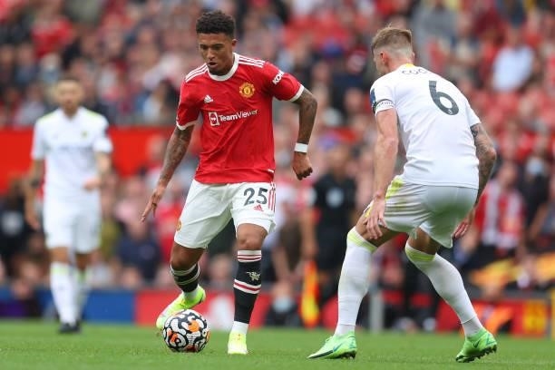 Jadon Sancho of Manchester United is closed down by Liam Cooper of Leeds United during the Premier League match between Manchester United and Leeds...