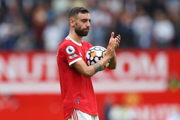 Bruno Fernandes of Manchester United acknowledges the fans following victory in the Premier League match between Manchester United and Leeds United...