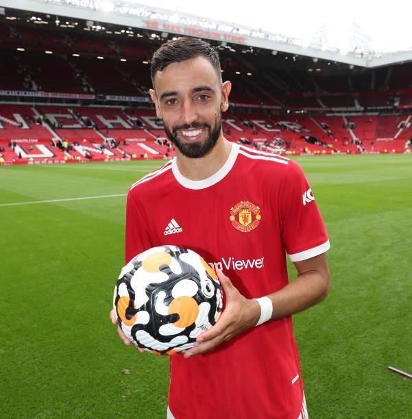 Bruno Fernandes of Manchester United poses with the match ball after the Premier League match between Manchester United and Leeds United at Old...