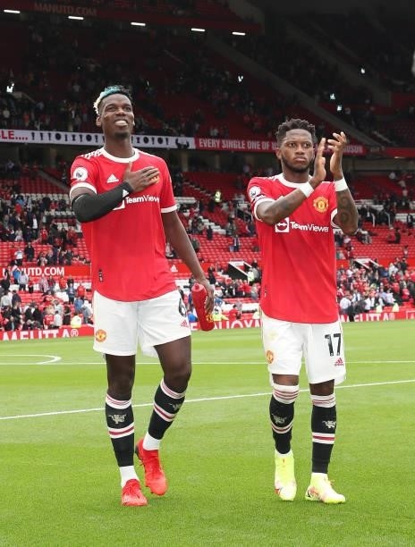 Paul Pogba and Fred of Manchester United walk off after the Premier League match between Manchester United and Leeds United at Old Trafford on August...
