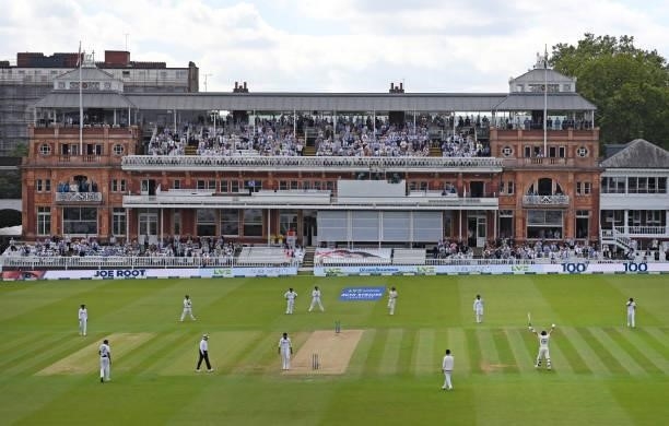 General view of the England batsman Joe Root celebrating his 100 during day three of the Second Test Match between England and India at Lord's...