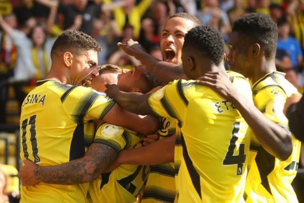 Cucho Hernandez of Watford celebrates with teammates after scoring their side's third goal during the Premier League match between Watford and Aston...