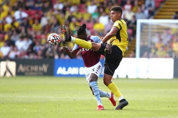 Bertrand Traore of Aston Villa and Adam Masina of Watford battle for possession during the Premier League match between Watford and Aston Villa at...