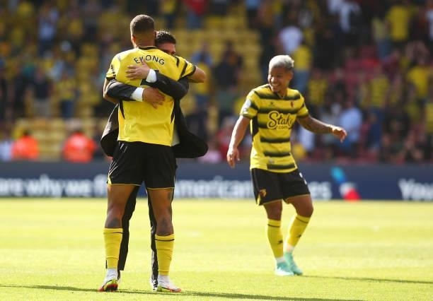 Xisco Munoz, Manager of Watford and William Troost-Ekong of Watford interact following victory in the Premier League match between Watford and Aston...