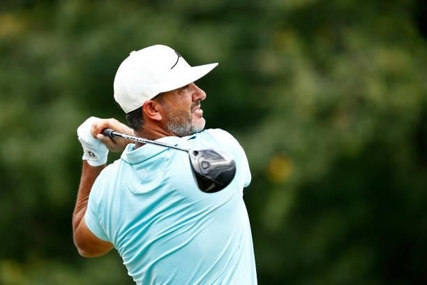 Scott Piercy of the United States plays his shot from the fifth tee during the third round of the Wyndham Championship at Sedgefield Country Club on...