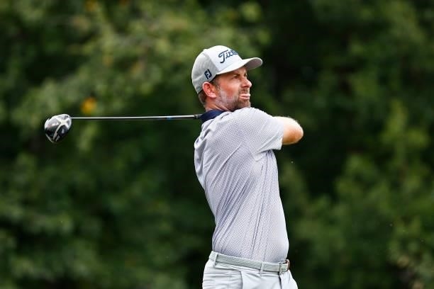 Webb Simpson of the United States plays his shot from the fifth tee during the third round of the Wyndham Championship at Sedgefield Country Club on...