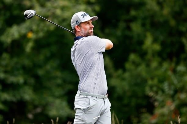 Webb Simpson of the United States plays his shot from the fifth tee during the third round of the Wyndham Championship at Sedgefield Country Club on...