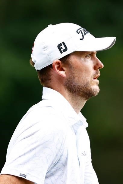 Russell Henley of the United States looks on as he walks off the second tee during the third round of the Wyndham Championship at Sedgefield Country...