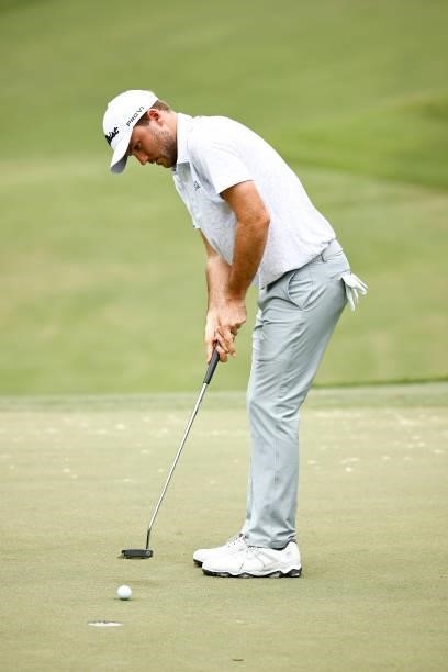 Russell Henley of the United States putts on the fifth green during the third round of the Wyndham Championship at Sedgefield Country Club on August...
