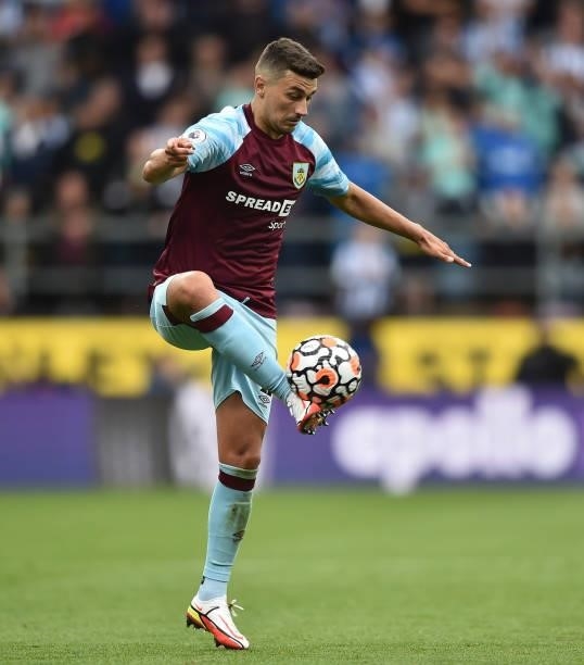 Matthew Lowton of Burnley controls the ball during the Premier League match between Burnley and Brighton & Hove Albion at Turf Moor on August 14,...