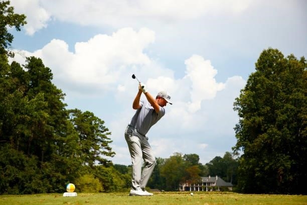 Webb Simpson of the United States plays his shot from the sixth tee during the third round of the Wyndham Championship at Sedgefield Country Club on...