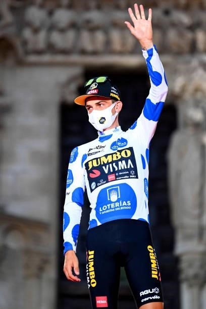 Sepp Kuss of United States and Team Jumbo - Visma celebrates winning the polka dot mountain jersey on the podium ceremony after the 76th Tour of...