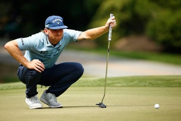 Tyler McCumber of the United States lines up a putt on the 11th green during the third round of the Wyndham Championship at Sedgefield Country Club...