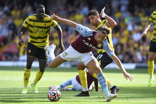 Jacob Ramsey of Aston Villa watches his shot get past Peter Etebo and Christian Kabasele of Watford during the Premier League match between Watford...