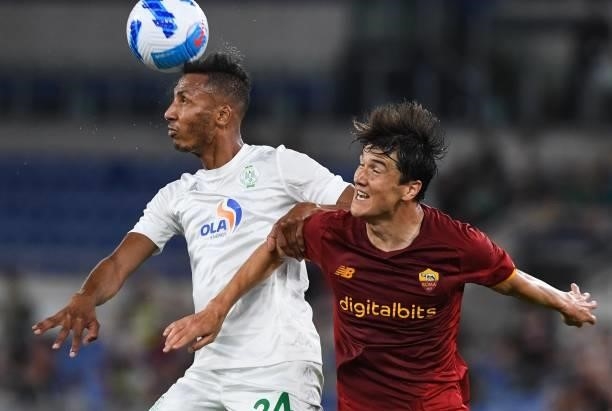 Eldor Shomurodov of AS Roma fights for the ball with Maroune Hadhoudi of Raja Casablanca during the pre-season friendly match between AS Roma and...