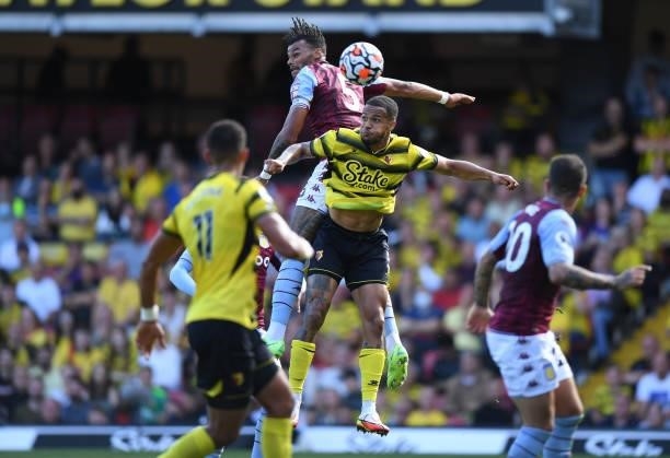 William Troost-Ekong of Watford challenges Tyrone Mings of Aston Villa during the Premier League match between Watford and Aston Villa at Vicarage...
