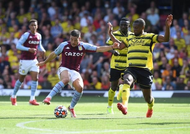 Emiliano Buendia of Aston Villa is challenged by Christian Kabasele of Watford during the Premier League match between Watford and Aston Villa at...
