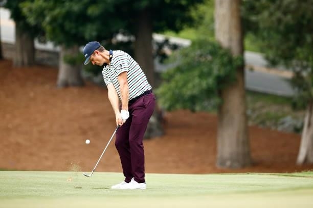 Justin Rose of England plays a third shot on the 11th hole during the third round of the Wyndham Championship at Sedgefield Country Club on August...
